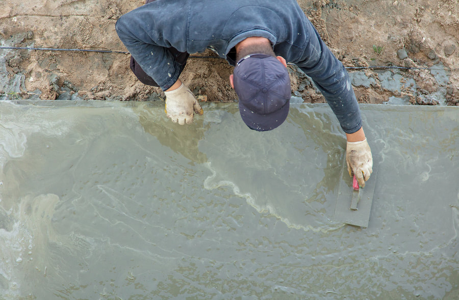 man working on a concrete ground